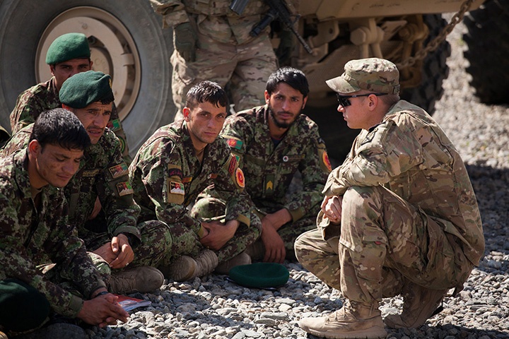 solders squatting and sitting